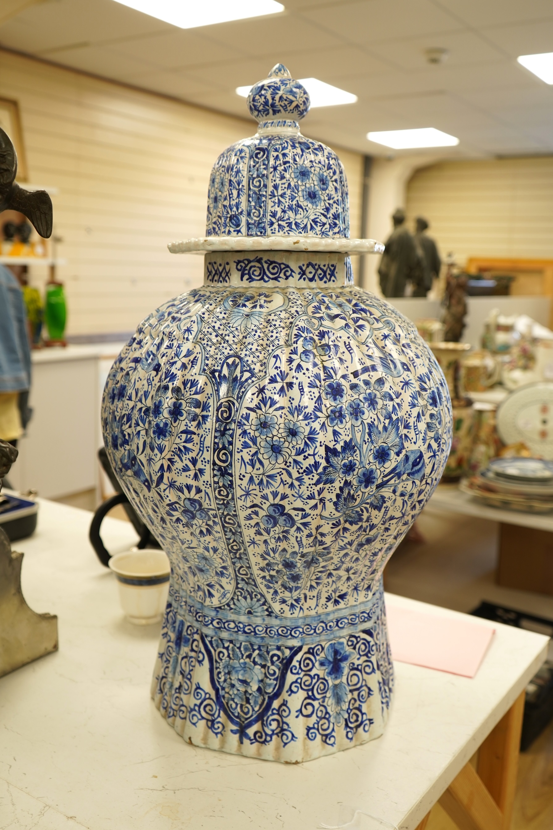 A large Delft blue and white vase and cover, 65cm tall